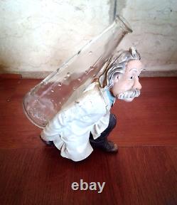 Antique Albert Einstein statue holding a glass bottle Heavy porcelain for offic