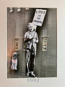 Print Of Einstein Holding A Peace Sign of Love Is The Answer